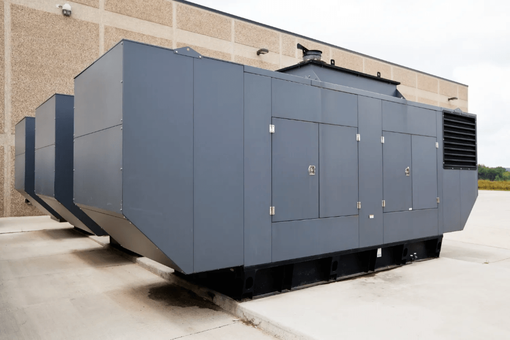 Large commercial diesel generator unit outside industrial facility